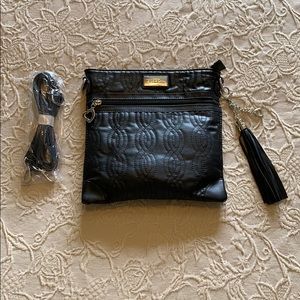 Black strapped purse with tassel